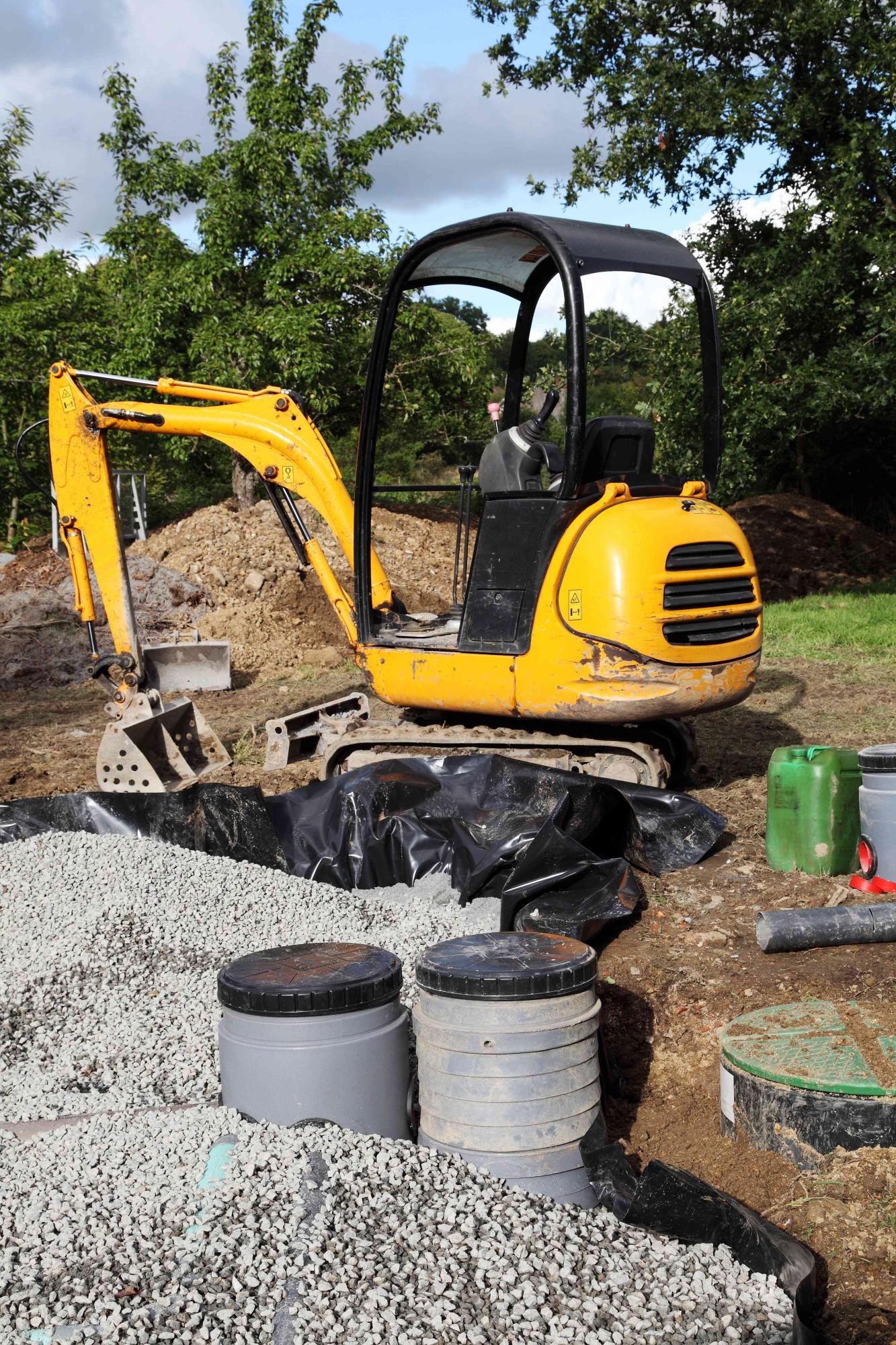 Mini Digger Installing Sand And Gravel Filter For Sewage